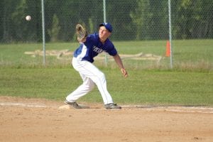 Sophomore 1st baseman Jacob Schroeder stayed focused on the ball and made a fine catch for an out in a home game played against a team from Thunder Bay. The boys played a doubleheader for practice against their neighbors to the north just before they headed into the Section 7A playoffs.