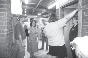 Several members of the Cook County Community Center Steering Committee and School District 166 staff toured the west wing of the school with Architect Dan Miller of JLG Architects on Friday, June 8. At this stop in the locker room, the group discussed how a YMCA and the school could share the space. The architect hopes to have drawings of the plan to attach the community center to the school at a July 12 meeting.