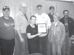 Rosemary Lamson, the daughter of Dr. Wallace “Doc” Smith, receives her father’s amateur radio QSL Card at the Boundary Waters Amateur Radio Club (BWARC) April 2012 meeting. Doc Smith was responsible for much of the growth of amateur radio in Cook County. At the presentation were (L-R) Dan Riddle, Rick Johnson, Rosemary Lamson, Pat Scully, Jerry Sivets, Kay Sivets and Doug Turner.