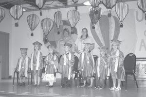 The end of an era! The very last “graduation” for the preschool students at North Shore Children’s House was held at St. John’s Catholic Church on May 23. The evening was bittersweet, as parents and grandparents enjoyed seeing their little ones graduate but sadly said goodbye to Mrs. A. (Gail Anderson) and Mrs. H. (Cheryl Hovde) as the preschool closed its doors this year. The preschool has been in operation at the First Congregational Church in Grand Marais since 1972. Mrs. H. has been the teacher for 20 years. After the graduation and some entertaining musical numbers by all of the preschool students, parents presented a photo collage of her students holding letters to spelling out THANK YOU MRS. H!