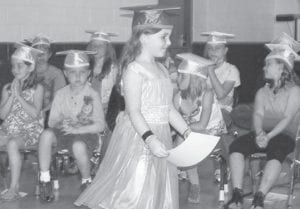 Savannah, in a beautiful pink dress, graduates. She will be in first grade next year.