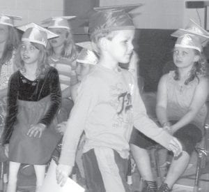 Conner proudly makes the graduation march.