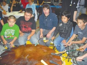 Left: The Little Eagle Singers were part of the recognition ceremony at the 2012 Johnson- O’Malley Award Potluck at the Grand Portage Community Center on May 23. One hundred thirty-seven K-12 students were recognized at the annual event. Also recognized were 22 adult Grand Portage band members and direct descendants who earned post-secondary degrees, licensure, or certification. Above: Cousins Ashley Deschampe and Colton Deschampe graduated together from Cook County High School on June 2.