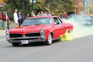 To start the parade off in style, Esten Nelson of Grand Marais, in his Pontiac LeMans, peeled out in a cloud of yellow smoke.