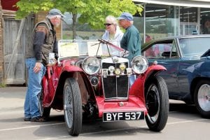 A little fog didn’t deter the car enthusiasts who wanted to share their beautiful classic cars with the public. Phil Anderson of Hovland chatted with a couple interested in his 1934 MG. To see more of the amazing automobiles in the Grand Marais Chamber of Commerce Classic Car Show, see page B4.