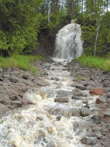 This little river that empties into Lake Superior near Five Mile Rock east of Grand Marais is normally so small that it doesn’t have a sign alongside Highway 61 announcing its name. The rains early the morning of June 20, however, created this rather substantial waterfall.