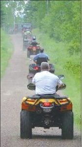 The highlight of the Cook County ATV Club’s Kick-Off and 10th anniversary celebration was the scenic trail ride. Riders are pictured here taking off on the Meridian Road, a historic county road.