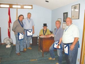 One last gathering. On June 7, 2012, Masonic Lodge No. 322 of Grand Marais gathered officially one last time to affirm its merger with Taconite Lodge No. 342 in Silver Bay. Signing was at the Grand Marais Blue Lodge. Signers were (L-R) Senior Warden Neil Hansen, Treasurer Paul Coe, Master Marland Hansen, Secretary Tom Westby and Junior Warden Al Barry.