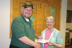 The mission to raise enough money to cover the costs of breeding, raising and training of a service dog in the American Vet Dog program continues in Cook County. Organizers got closer to their goal, thanks to a generous donation of $250 from Grand Portage American Legion Post 2009. Grand Portage Legion member and Cook County Veterans Services Officer Clarence Everson presents the check to Reverend EvaLyn Carlson for the Vet Dog program.