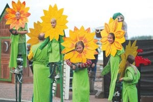 Spring also brings flowers to Granny’s house and in the Summer Solstice Pageant, the flowers grow quite tall—as if they had stilts for stems!