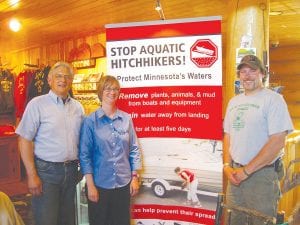 In response to the arrival of aquatic invasive species in our region, a group of concerned citizens has begun to develop strategies to slow the spread. Pictured at a recent meeting are (L-R) Bill Mittlefehldt, president of Hungry Jack Lake Owners Association, Marte Kitson of Minnesota SeaGrant and Forrest Parson of Hungry Jack Lodge.