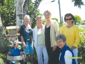 Enjoying a woodland garden are Grand Marais Garden Club members ((L-R) Chairpersons Sally Berg and Cheryl Christenson, Jan Attridge, Anne Penny Skip Joynes (front). The annual Garden Club Flower Show will be held July 20 at the Cook County Community Center.