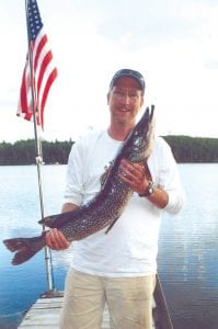 Left: Patrick Riley of Oklahoma City and West Bearskin Lake caught this huge Northern on a Boundary Waters lake on July 9. The big fish was 38 inches long and had a girth of 17 inches.