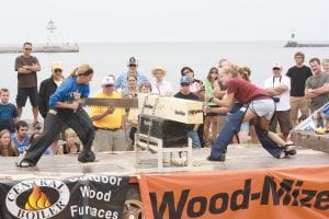 Competitors bear down in the crosscutting contest as they power their way through the log. The timed event tests your fitness and ability to work together with a partner. This is one of many events held at the Fisherman’s Picnic Lumber Camp held over Fisherman’s Picnic weekend August 2-4 that people can either watch, or choose to participate in.