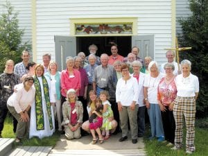 Members of Spirit of the Wilderness Episcopal Church in Grand Marais gathered to celebrate the church’s fifth birthday recently. Joining the congregation at the Maple Hill Church was Vicar Alex Logan (second from left in front) visiting from England. The church has accomplished a lot in its short life.