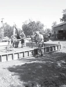 The Birch Grove Community Center is a very busy place this summer as 1-percent-tax-funded recreational improvements are under way. Tofte Supervisor D.C. Olsen said primarily local contractors are doing the work. Top: Last week crews from Edwin E. Thoreson, Inc. and S&C Masonry and Concrete were hard at work on the new ice rink and warming house. Above: The outdoor classroom pavilion will soon be moved to new footings on this spot closer to the Birch Grove Community School.