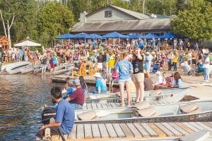 The Gunflint Lodge waterfront is normally a fairly quiet place but for the 2012 Gunflint Canoe Races, the lakeshore was packed with excited people who came to watch the paddlers. It didn’t hurt that the weather was absolutely perfect, said Ronnie Smith, who has been race coordinator for eight years now.