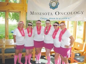 The event included contests such as “closest to the pin, “longest putt made,”“hit into the pool” and other fun games. Participants decorated their golf carts—and themselves!—with pink like this fun-loving team.