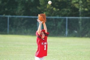 Above: Eyes closed tightly and prayers of “Please, please, please, please, please let me catch the ball!” Charlet Waver threw her glove up, and yes, the astonished Parent Pitch player did make the catch.