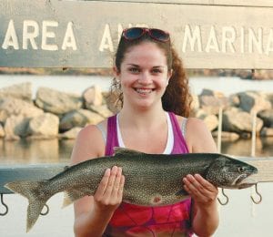 Brooke Anderson from Pequot Lakes was very happy to show off this nice 9-pound lake trout she caught aboard the Fishin' Chics & Dad with Captain David Williams.