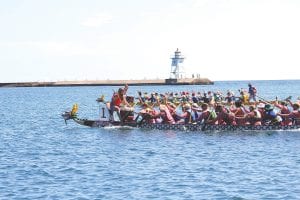 The North Shore Dragon Boat Festival on Saturday, July 28 was fun to watch—from shore, from the lighthouse or from the breakwall. Dragon Boat team members work as one, synchronizing their paddle strokes to the sound of the drum.