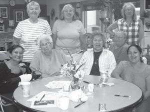 Above: Grand Portage is one of the first Elder groups to participate in the Pink Shawl program sponsored by the American Indian Cancer Foundation. A number of women gathered on July 27 to sew seven shawls for breast cancer survivors. Some of them were (L-R, seated) Laura Keys, Bernice LeGarde, Ellen Olson, Dottie Griffith, Kris Rhodes. (L-R, standing) Carol Hackett, Michelle Hoy, Carol Conrad. (Not pictured Delma Grandlouis and Patty Winchell-Dahl.) Left: Elders had a great time on a berry-picking adventure in Thunder Bay. Two of the berry-pickers were Ellen Olson and Bernice LeGarde.