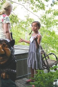 One of the most enthusiastic participants in the eighth annual Edwin Lundie Cabin and Vacation Home Tour on July 14 was Miranda Lukas, 10, of Minneapolis. With an avid interest in design and keen observational skills, she kept up with the most ardent adult architecture aficionado throughout a long afternoon touring seven homes from Schroeder to Lutsen. She has become a bright spot in the annual fundraiser for the Schroeder Area Historical Society. Her grandfather, Steven Lukas of Schroeder, hosts a picnic after the tour each year on the Lake Superior shoreline just outside his own Edwin Lundie cabin. Miranda is a knowledgeable and gifted speaker and offers guided tours of her grandfather’s home and guest quarters at the end of the day.