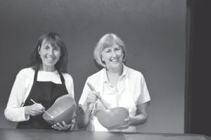 The Kitchen Witches—Isobel Lomax and Dolly Biddle—are all smiles when the cameras are rolling for their TV cooking show. However as soon as their highlyrated program is off the air, their longstanding feud resumes. Don’t miss the Grand Marais Playhouse’s production of The Kitchen Witches with Grace Bushard (left) as Isobel and Marcia Hyatt as Dolly. The Kitchen Witches premieres Thursday, August 23.