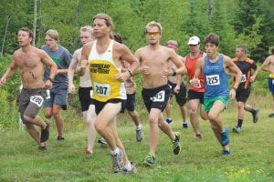 Looking strong and fit, this group of men worked hard to gain some separation from one another. On the left wearing bib No. 280 is Derek Smith. John Martinsen, in bib No. 207, leads the pack with Kieran Scannell (shirtless) just behind him and Jeremy Dockan, No. 245 just off his shoulder. Shane Steel, wearing bib No. 225, bides his time before breaking away from the field on his way to a convincing victory.