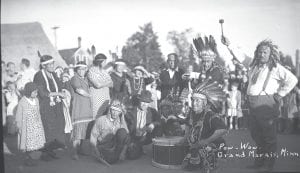 This photo is one of the Milford J. Humphrey collection and is filed at the Cook County Historical Society as “Grand Portage Powwow, circa 1930.” However, the picture has a photographer’s note on the front saying “Pow-Wow Grand Marais, MN.” Wherever the photo was taken it is an interesting look at the regalia of powwow over 80 years ago.