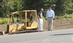 U.S. Representative Chip Cravaack (right), visited Grand Marais on Friday, August 10, hand-delivering a copy of the legislation that paved the way for completion of the County Road 8 roadwork. In addition to visiting with Cook County Highway Department staff at the shop, Cravaack checked out the road project with County Engineer David Betts.