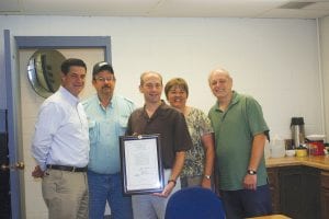 U.S. Representative Chip Cravaack visited the Cook County Highway Department on Friday, August 10 to deliver a copy of the bill, signed by President Barack Obama on June 8, 2012, that allows the highway department to purchase land from the Cook County Airport for County Road 8 reconstruction. Visiting at the county highway garage were (L-R) Representative Cravaack, Highway Department Maintenance Supervisor Russell Klegstad, County Engineer David Betts, and Commissioners Sue Hakes and Bruce Martinson.