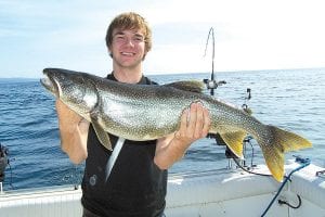 Alex Smith from Savage, Minnesota had a great day of fishing with Captain Darren Peck of Tofte Charters. Alex reeled in this beautiful 12 pound, 33½ inch lake trout.