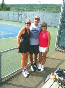 Lisa Topp of Silver Bay and Scott Bergstrom and Lee Bergstrom of Grand Marais relax between matches at the Sunday, August 12 round-robin tournament at the Cook County tennis courts.