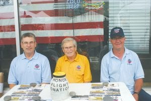 Above: Sharing stories of their memorable Honor Flight trip to Washington D.C. during Fisherman’s Picnic were Honor Flight Guardian David Lovaas, Korean War Veteran Ken Lovaas and Honor Flight Guardian Orvis Lunke. The men were raising money for the Northland Honor Flight to help other vets travel to Washington D.C. to see the memorials built in honor of their sacrifices. Guardians pay their way to assist veterans on the trip, but for veterans the flight is free, in appreciation of their service.