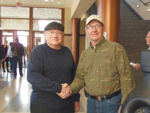 Left: Orvis Lunke of Grand Marais served as a Guardian on the May 15, 2012 Northland Honor Flight, accompanying two Duluth-area World War II veterans. He is pictured here with one of those gentlemen, Ken Mueller.