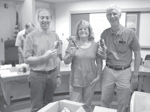 August 28, 2012 was Cook County Employee Recognition Day. For one hour in the afternoon, the five county commissioners handed out ice cream treats to employees in the Commissioners’ Room. Earlier they had signed a proclamation that stated, “Whereas Cook County employees contribute significantly to the well-being and quality of life of all citizens in the county; and whereas Cook County’s public servants have demonstrated unmatched commitment to their fellow citizens by providing vital services in all areas of public health, human services, law and order, finance and administration, communications, personnel, infrastructure and maintenance, planning and zoning; and whereas during these difficult fiscal times our dedicated public servants have taken on additional duties, found ways to cut costs, defined more efficient processes, and expended the taxpayers’ resources with prudence and restraint; …therefore the Cook County Board extends its appreciation and gratitude to all county employees for their continued dedication and commitment to excellence.” Pictured here (L-R) are County Engineer David Betts and commissioners Jan Hall and Jim Johnson.