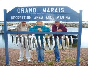 While fishing with Captain Jerry Skarupa aboard Secret Lures, these friends caught their limit of salmon and two nice lake trout. Happily showing off the catch of the day are Paul Anderson of Grand Marais, Jan Karnas of Rochester, MN and Dan Strootman of Sunburg, MN.