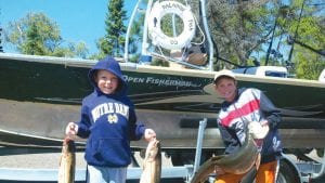 Nicolas and Anthony Berscheit pulled in a 6-pounder and an 18-pounder. They caught the big lake trout while fishing with their dad and uncle on a Halsnoy Fish Company Charter with Captain Dale Tormondsen of Tofte.