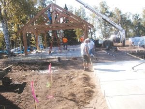 Improvements on the grounds of Birch Grove Community Center in Tofte are really taking shape. Cement leading to the timber frame picnic pavilion was poured and its roof was shingled this week. A problem with the grade of the playground area led to a delay in its installation, but Tofte Township Supervisor Alan “D.C.” Olsen hopes that can be done next weekend after the first week of school.