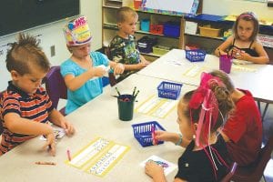 Above: Sawtooth Elementary School in Grand Marais was abuzz with kids returning to school—or coming to school for the very first time, like these kindergarteners in Dena Schliep’s class. While these kindergarteners worked they had lots of questions for Mrs. Schliep.