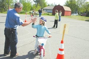 An instructor from the League of American Bicyclists will be in Grand Marais September 14 – 15 to offer Traffic Skills 101. Although this bicycle safety class is for adults and children above age 14, there is a possibility that someone taking the course could become an instructor themselves—or at least a helper like Rory Smith at the May 2012 Cook County Bike Rodeo.