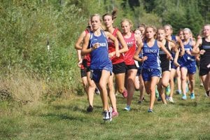 Above: Looking strong, Sarissa Falk led the Viking girls’ team with a third place finish in the varsity race. Sarissa finished far ahead of all of the other Class A runners in the field. Not far behind Sarissa in this picture is teammate Matea Acero, and three runners behind Acero is Sarah Shied. The girls’ team placed third and with some improvement has a chance to qualify for state this year. Left: Roman Schnobrich had a good day on the trails, placing 14th in the junior varsity race.