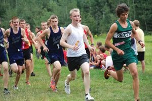 Above: Kieran Scannell (white shirt) and Matt Welch from Proctor renewed an old rivalry at the Cook County High School Invite held at Pincushion Mountain on Thursday, August 30. Welch got the best of Kieran on this day and will be a favorite to win the Minnesota boys’ cross-country state championship.