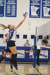 Left: As Linden Sutton looks on, Ali Iverson uses a light touch to tap the ball over the net to score a point against Silver Bay in the first home volleyball game of the season on Tuesday, September 4. Above left: Rachel Wieben gets ready to spike the ball on this play against the Silver Bay Mariners. Wieben had a great day of all-around play on the court. Above right: Theresa Morrin made a great save on this ball, as Abbey Sutton gets ready to take the bump. The Vikings got the win over Silver Bay in five exciting games.