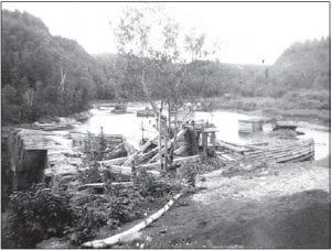 This photo was taken in 1946 of the Pigeon River above the falls. Bob Johnson of Lutsen had just gotten out of the Navy and he and two other servicemen took a trip to Thunder Bay. Johnson recalled that clothing was not readily available, so they traveled to Canada where they could find “really good quality woolens and good prices.” Along the way they did some exploring and Bob took this picture of the river logging operation under way. This picture shows the “head frame” where the logs enter a chute.