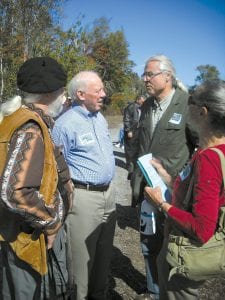 Above: (L-R) Native American/Scandinavian musician Larry Martin, former U.S. Congressman Jim Oberstar, Father Michael Tegeder of Gitchitwaa Gateri (a Catholic parish in Minneapolis), and Native American musician Claire Martin chat before a celebration of Father Frederic Baraga’s legacy at the Father Baraga Cross in Schroeder on September 15. The event brought together Slovenian Americans, Catholics advocating for Baraga’s sainthood, and Catholic Native Americans who remember Baraga’s dedication to the Native people in the 1800s. Right: Yul Yost, born and raised in Slovenia, is a Father Baraga historian who has done a lot to keep Baraga's memory alive. He was integral in organizing this event.