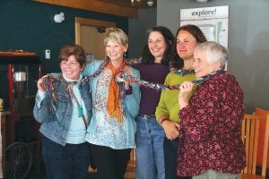 Right: This group had a lot of fun choosing strands of fibre to use in making this very long scarf and then working together to braid it. Braiding long groupings of fiber strands as a group becomes a rhythmic dance of sorts. (L-R) Mary Bebe, Linda Vanden Brook, Diane Pearson, Jane Howard, and Mary Sanders.