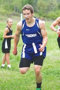 Far Left: Charging hard, Levi Axtell led the first 300 yards of the Milaca crosscountry meet. Although he didn’t win, Levi ran a fine race and finished in 18:58 for the5krace.Above:Sarah Schied ran 17:19 for 2.5 miles and placed 91st overall in the girls' race. Left: Ben Seaton finished in 18:32 to place 74th. The boys' team finished 16th and the girls' team placed 15th at Milaca, the largest high school cross country meet in America.