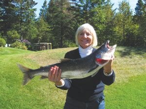 Colleen Brennan shows off her third place fish, another beautiful trout caught aboard the Freeloader Charters with Dick Nelson.